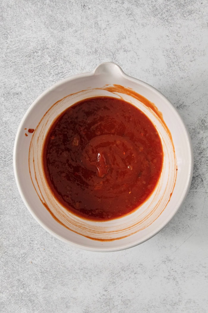 Overhead view of meatloaf glaze in bowl