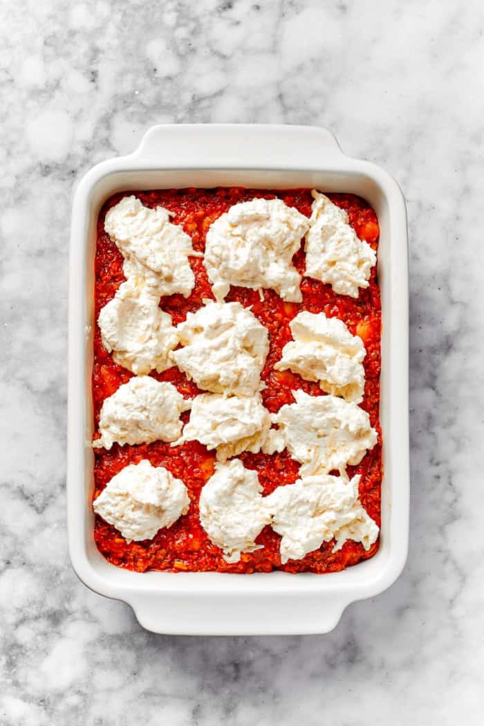 Dollops of Cheesy Yum added to lasagna beans