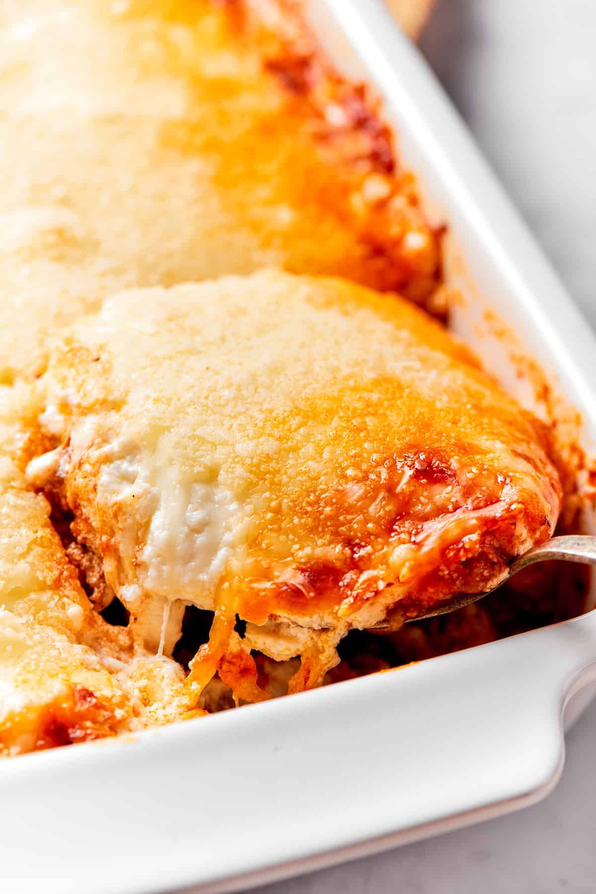 Lifting portion of lasagna beans from casserole dish