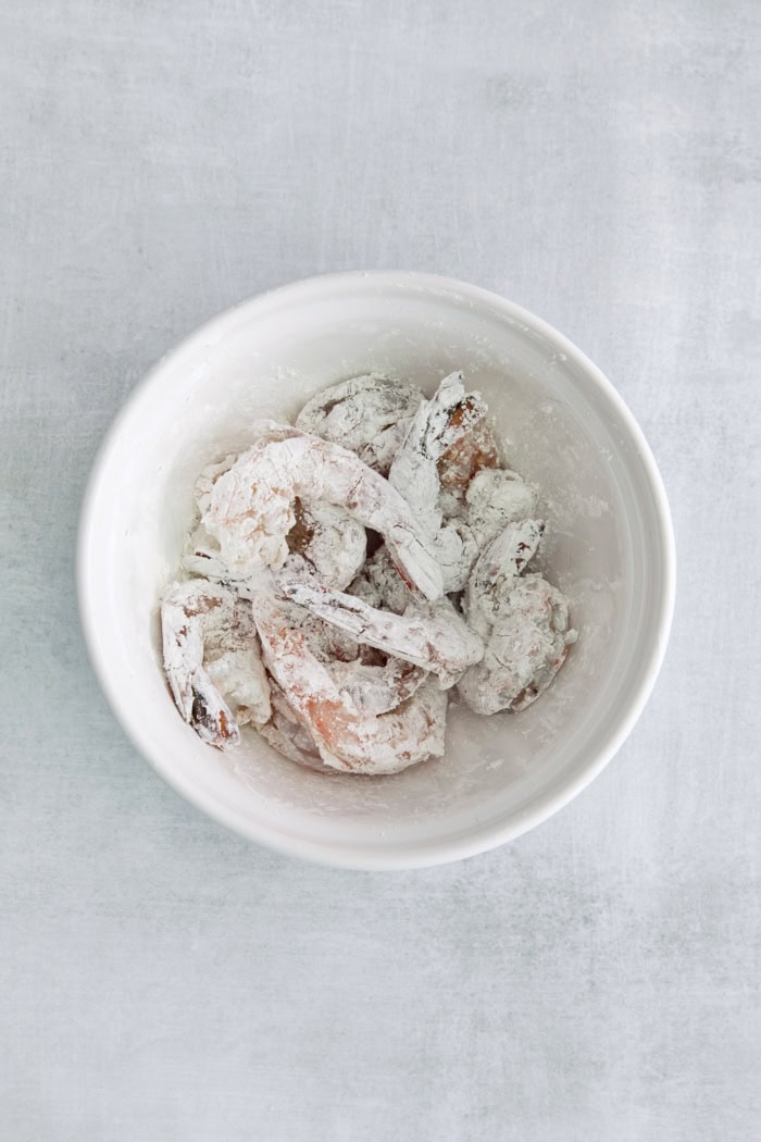 Overhead view of shrimp coated in cornstarch