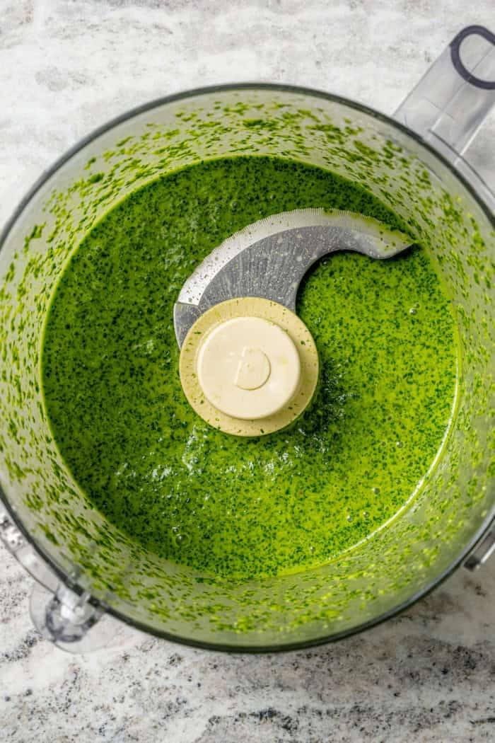 Overhead view of cilantro lime vinaigrette in food processor
