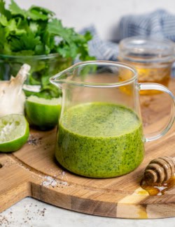 Homemade cilantro lime vinaigrette in glass pitcher