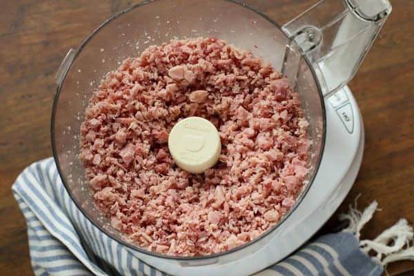 chopped ham in a food processor bowl