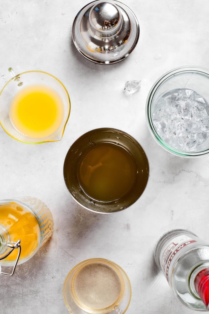 Overhead view of cocktail shaker and ingredients for limoncello martini