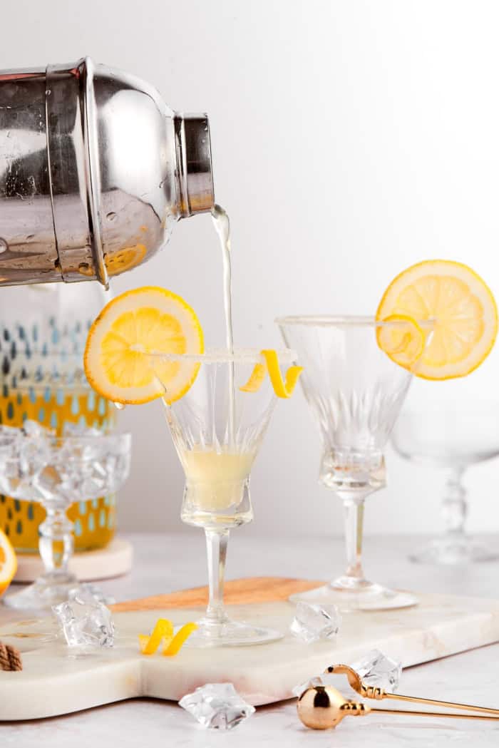 Pouring limoncello martini into glass