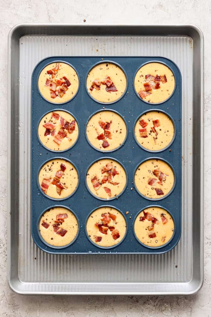 Overhead view of unbaked cottage cheese egg bites in silicone pan