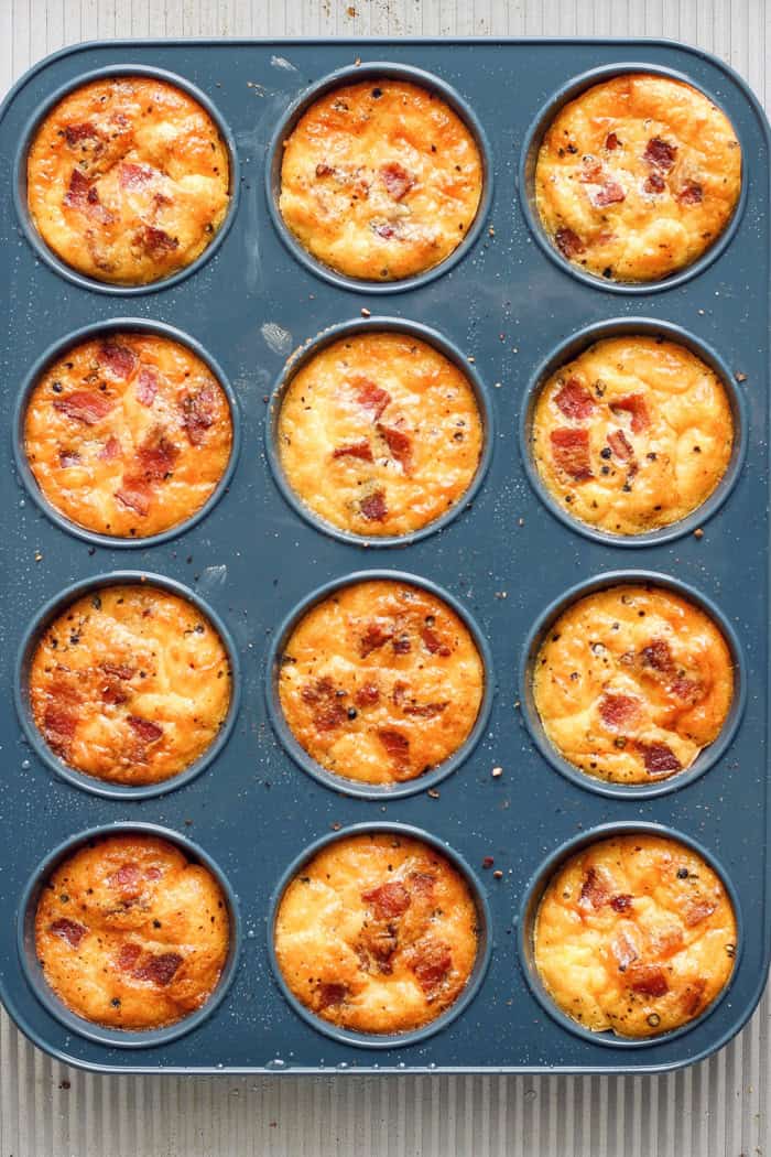 Overhead view of baked cottage cheese egg bites in muffin pan