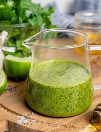 fresh homemade cilantro lime vinaigrette in a small clear pitcher