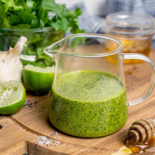 fresh homemade cilantro lime vinaigrette in a small clear pitcher