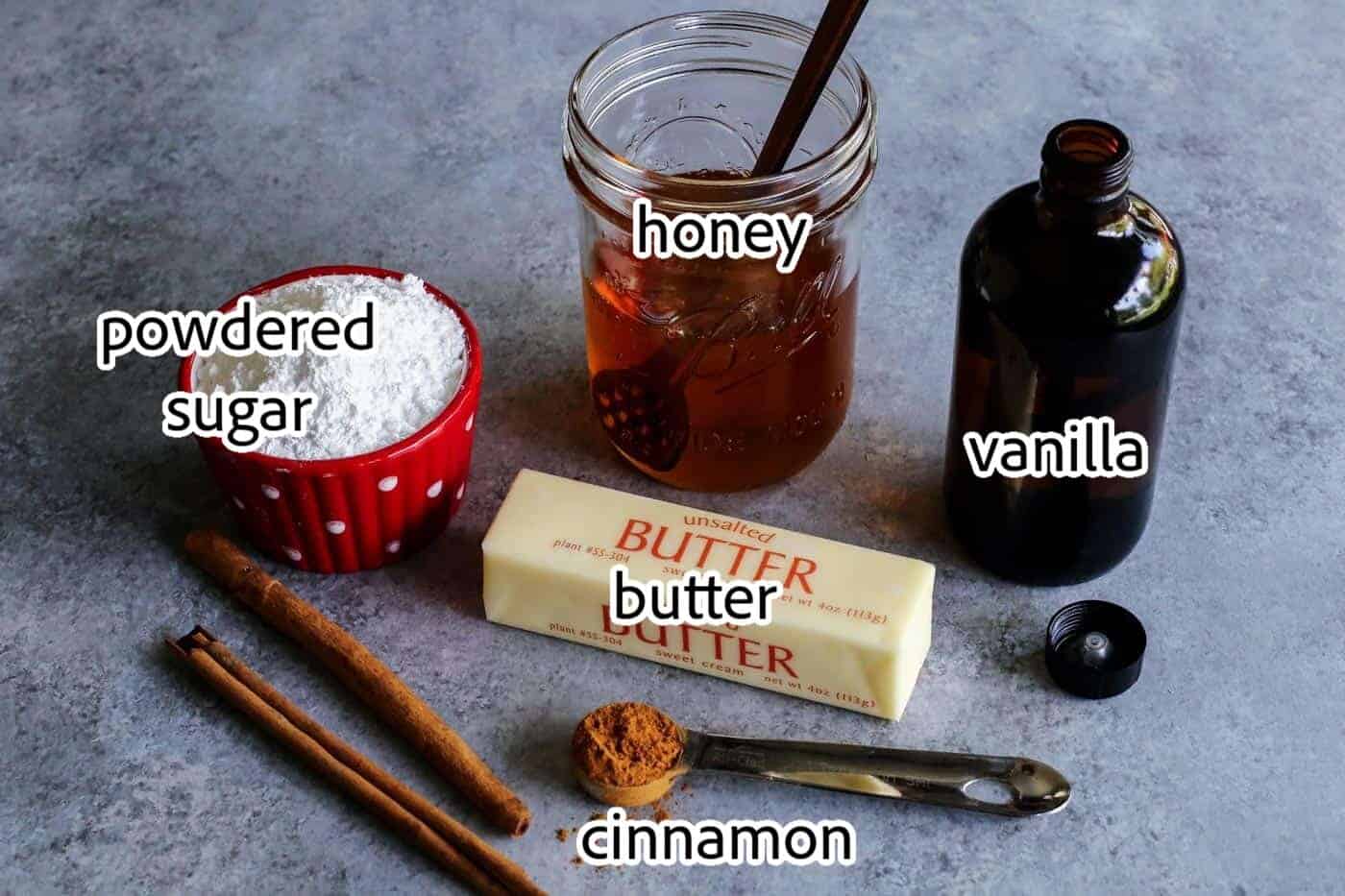 This easy cinnamon honey butter is whipped, fluffy, and even better than Texas Roadhouse butter! Make it with 5 ingredients in 10 minutes! Cinnamon honey butter ingredients with text labels overlaying each ingredient.