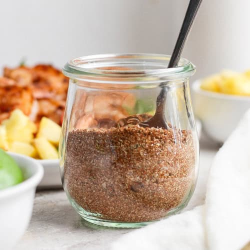 Spoon in jar of jerk seasoning