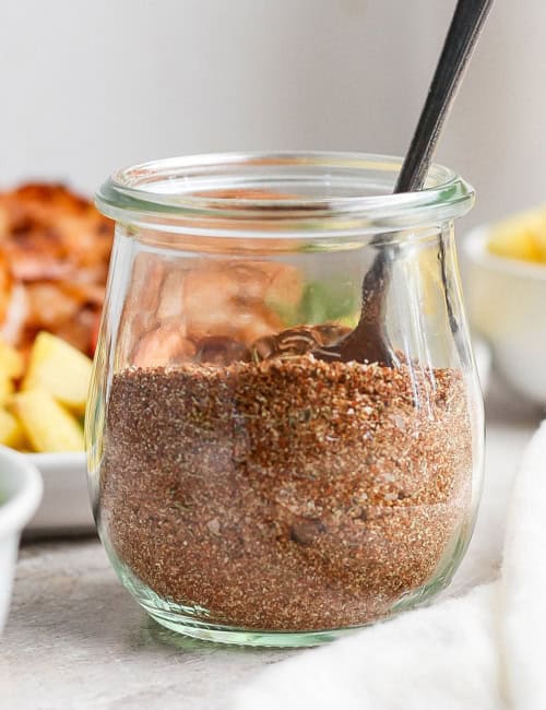 Spoon in jar of jerk seasoning