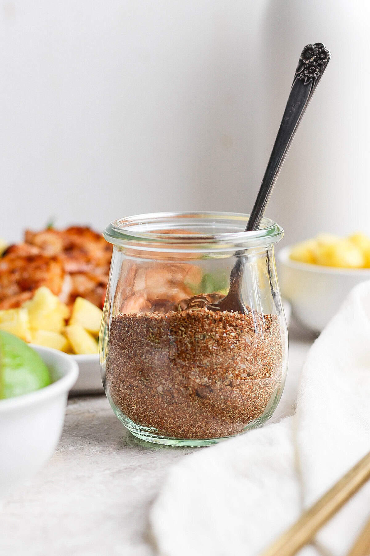 Jerk seasoning is a spicy, sweet, smoky and savory blend that gives any dish island vibes. Mix it up in minutes and use it on ALL the things! Jar of jerk seasoning with spoon