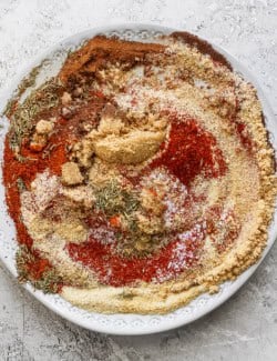 Overhead view of ingredients for jerk seasoning before mixing in bowl