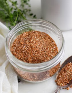 Jerk seasoning in jar and on spoon