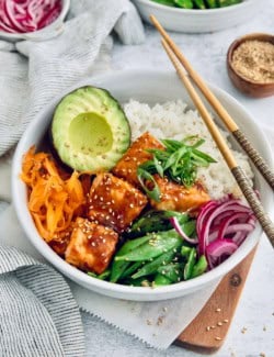 Teriyaki salmon bowl with chopsticks set on top