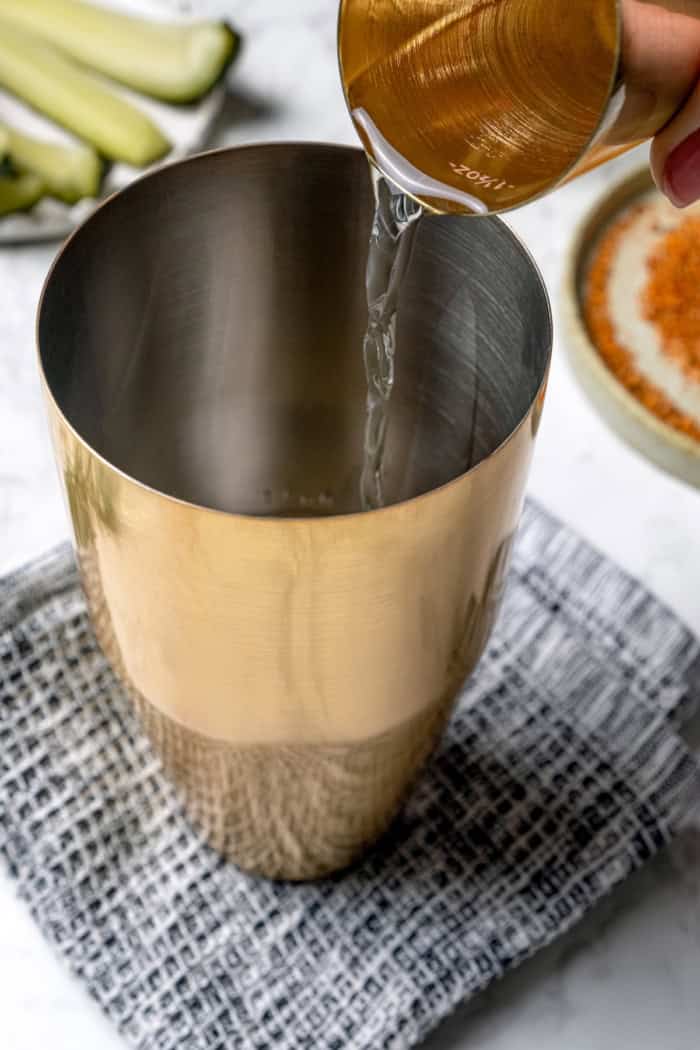 Pouring tequila into cocktail shaker
