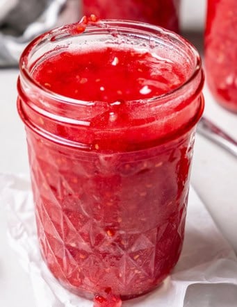 a jar of homemade raspberry freezer jam