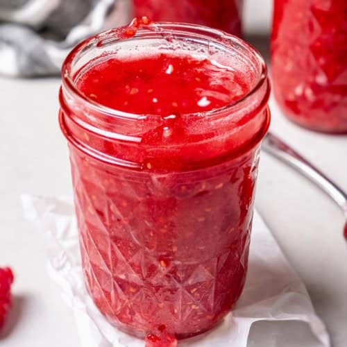 a jar of homemade raspberry freezer jam