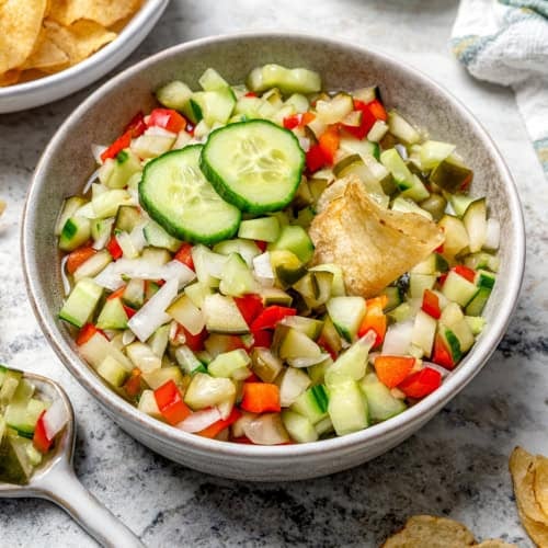 a bowl of chopped pickle salsa, also called pickle de gallo