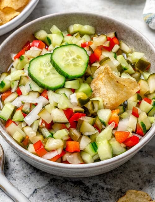 a bowl of chopped pickle salsa, also called pickle de gallo