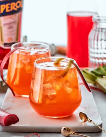 two glasses of Rhubarb Aperol Spritz cocktails