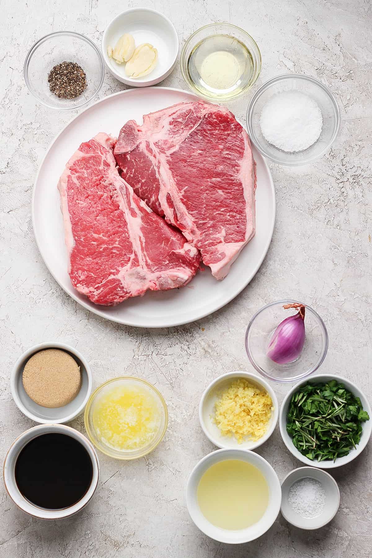 Overhead view of ingredients for grilled t-bone steak and board sauce