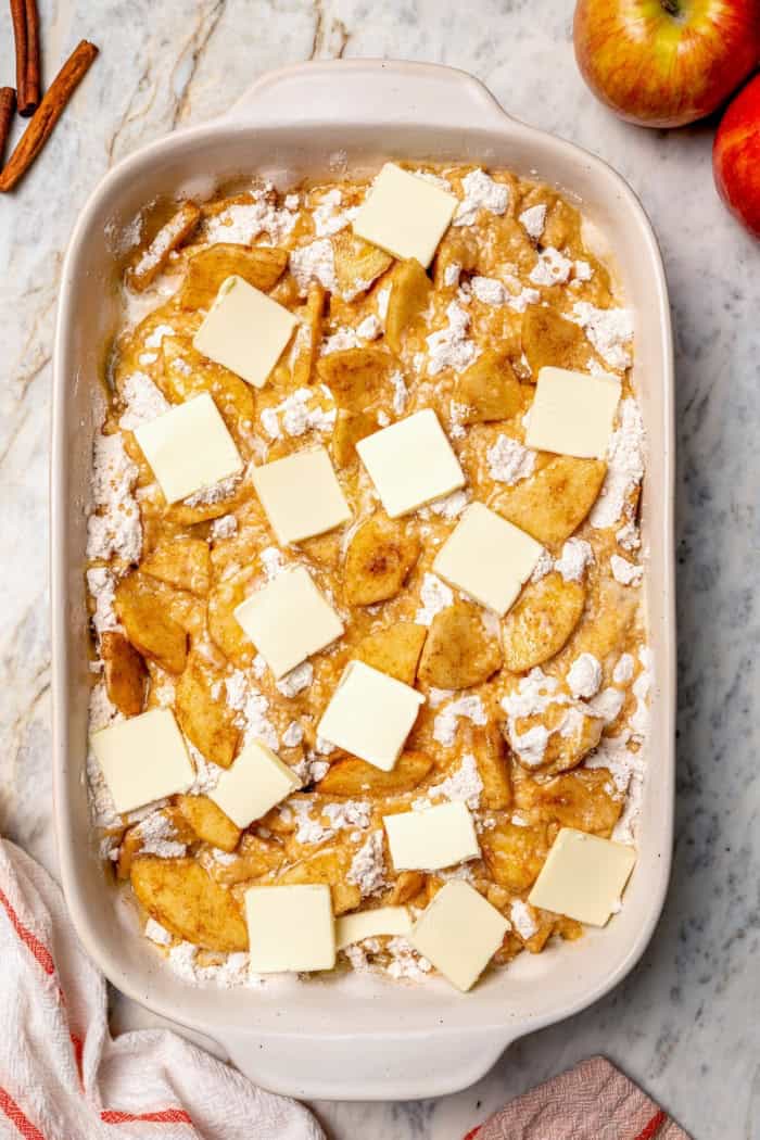Overhead view of apple dump cake in pan before baking.