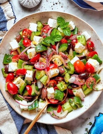 chopped Greek salad on a white platter