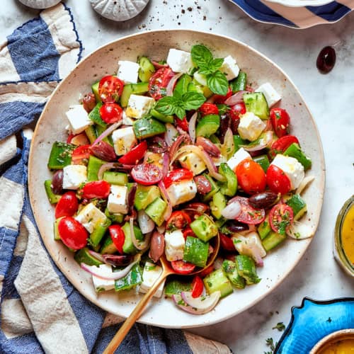 chopped Greek salad on a white platter