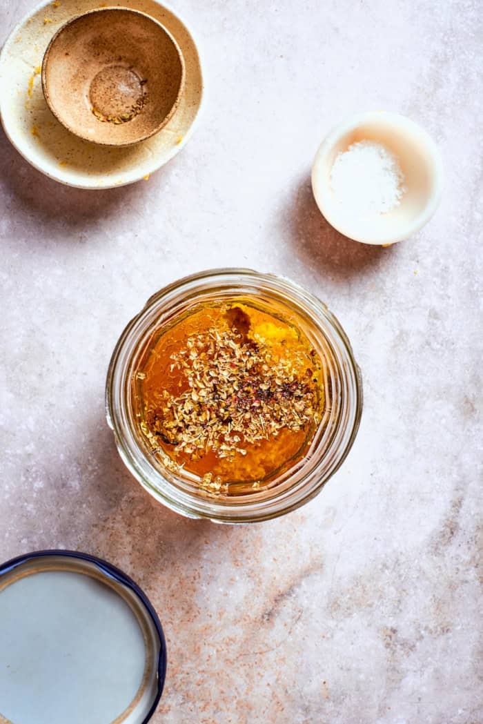 Ingredients for Greek salad dressing in jar