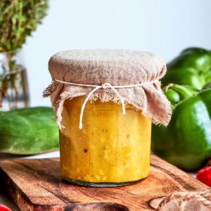 Greek salad dressing in a jar, with a fabric cover