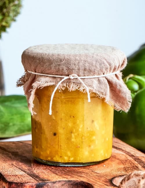 Greek salad dressing in a jar, with a fabric cover