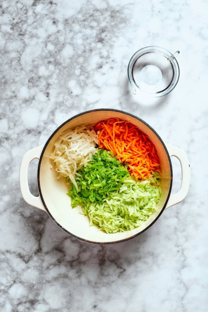Overhead view of shredded vegetables in pot