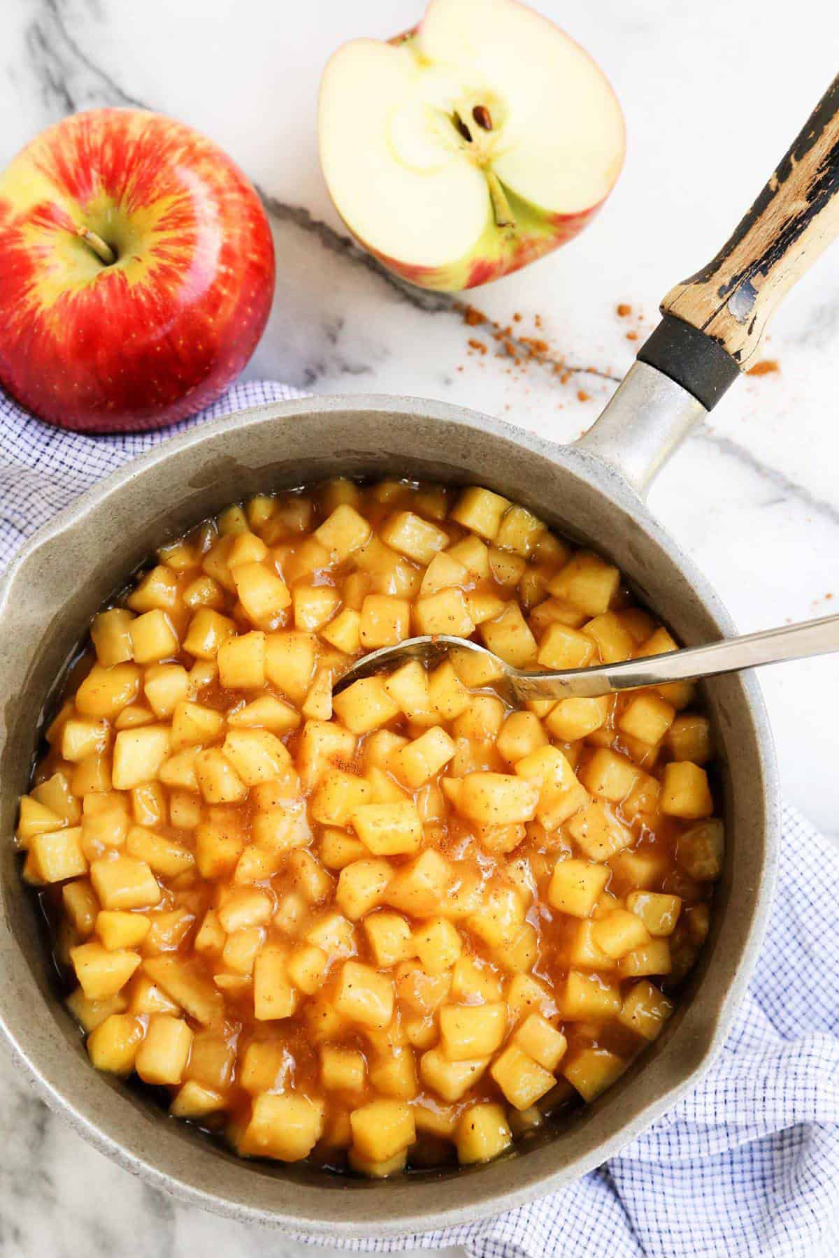 a saucepan full of diced cinnamon apples