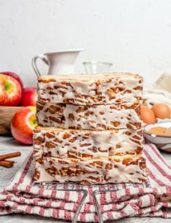 stacked slices of apple fritter bread, showing the glazed topping