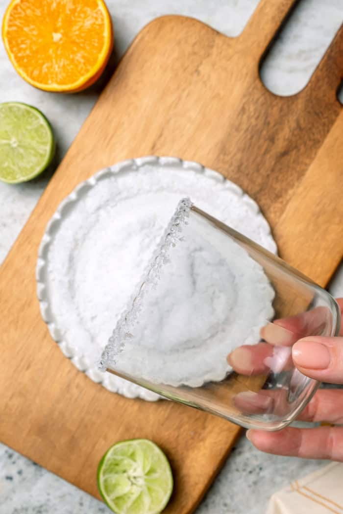 Deliciously tart and refreshing, this fizzy Margarita Mocktail has the bright citrus flavor of the real-deal, in non-alcoholic form! Salting rim of glass for mocktail margarita