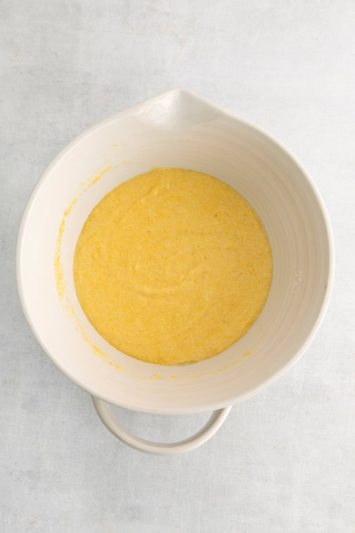 wet and dry ingredients combined in a mixing bowl