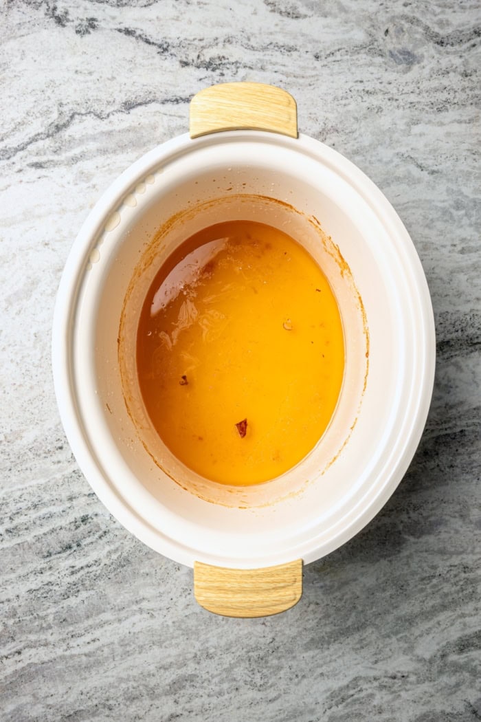 Ham drippings in crockpot.