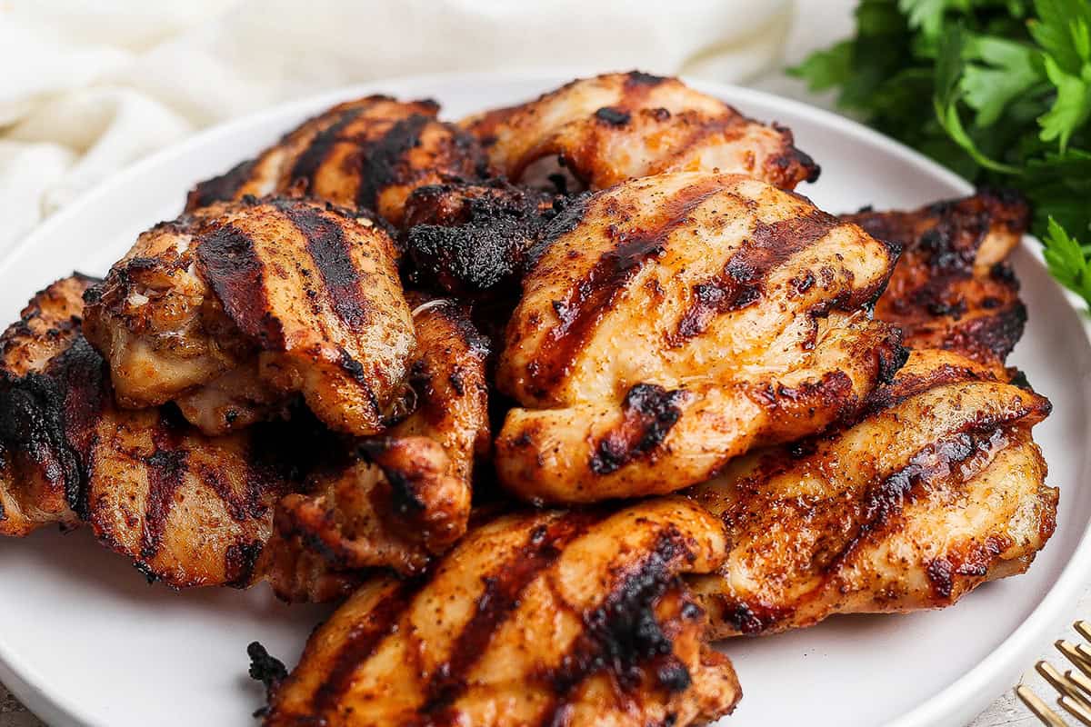 Platter of grilled chicken thighs.