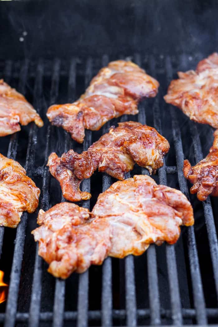Chicken thighs on grill.