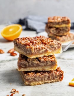 Stack of 3 pecan pie bars.
