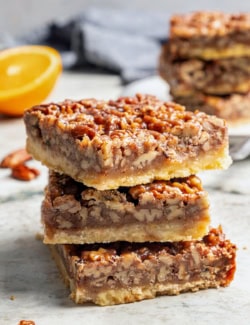 a stack of pecan pie bars