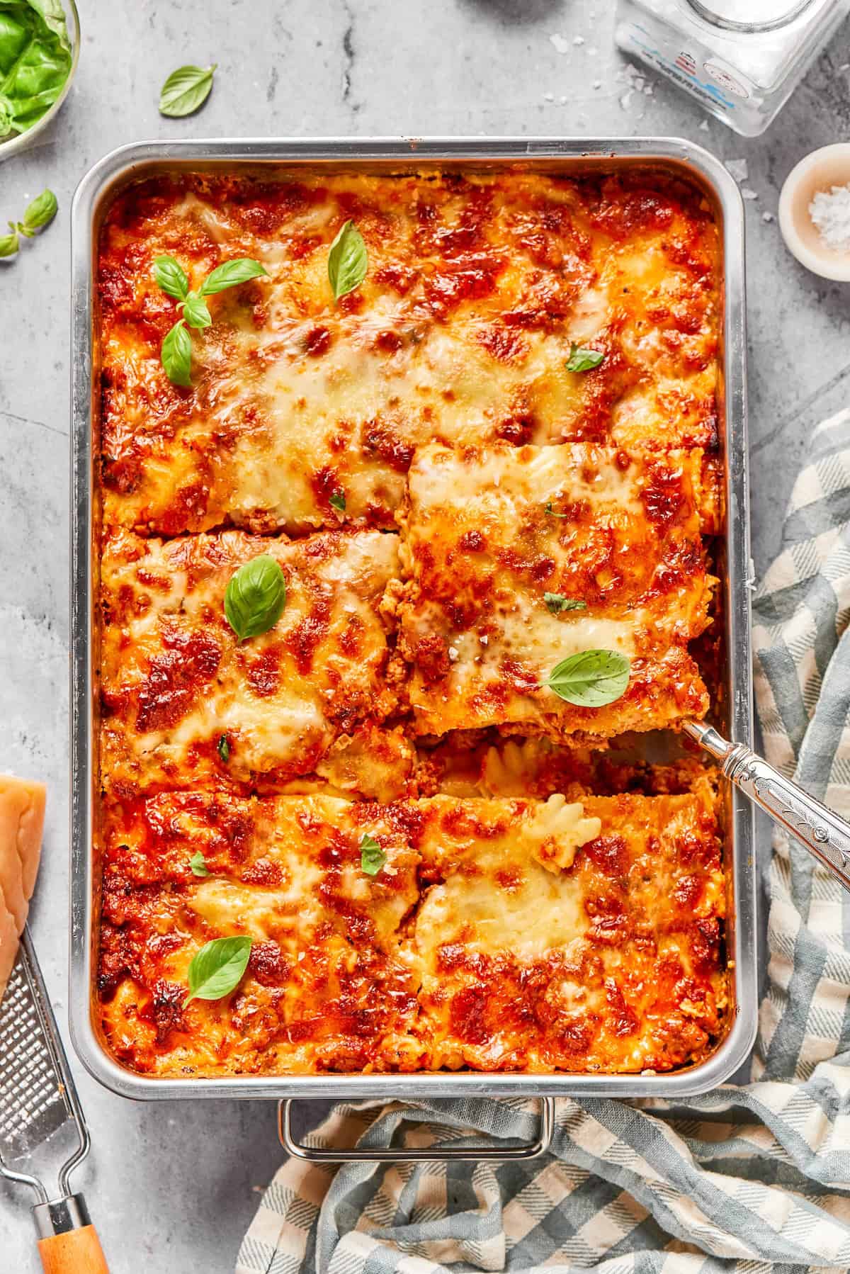 Pan of lazy ravioli lasagna cut into 6 large portions.