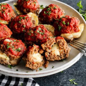 meatloaf muffins stuffed with cheese, on a white plate