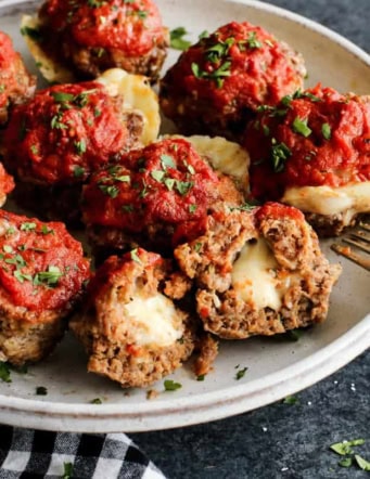 meatloaf muffins stuffed with cheese, on a white plate