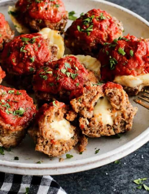 meatloaf muffins stuffed with cheese, on a white plate