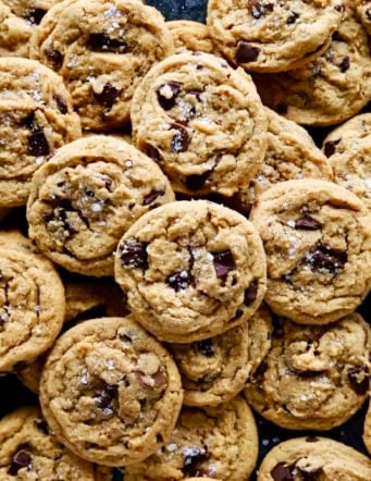 overhead photo of a big spread of peanut butter chocolate chip cookies
