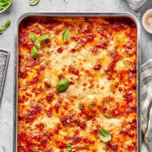 overhead photo of lazy ravioli lasagna baked in a metal 9x13 pan
