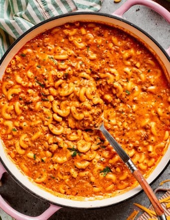 overhead photo of a pink pot of cheesy hamburger helper